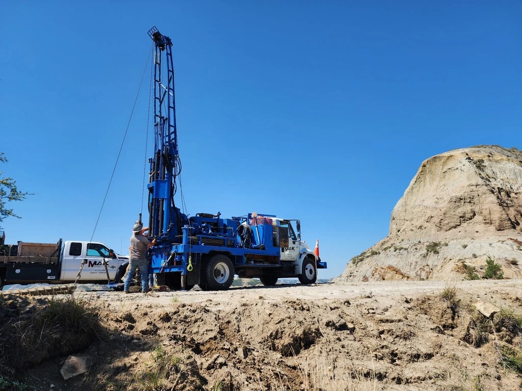 MAK Drilling rig on difficult terrain in the field.